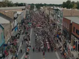 An aerial view of a crowd following the Kincardine Scottish Pipe Band as they parade on Queen Street.