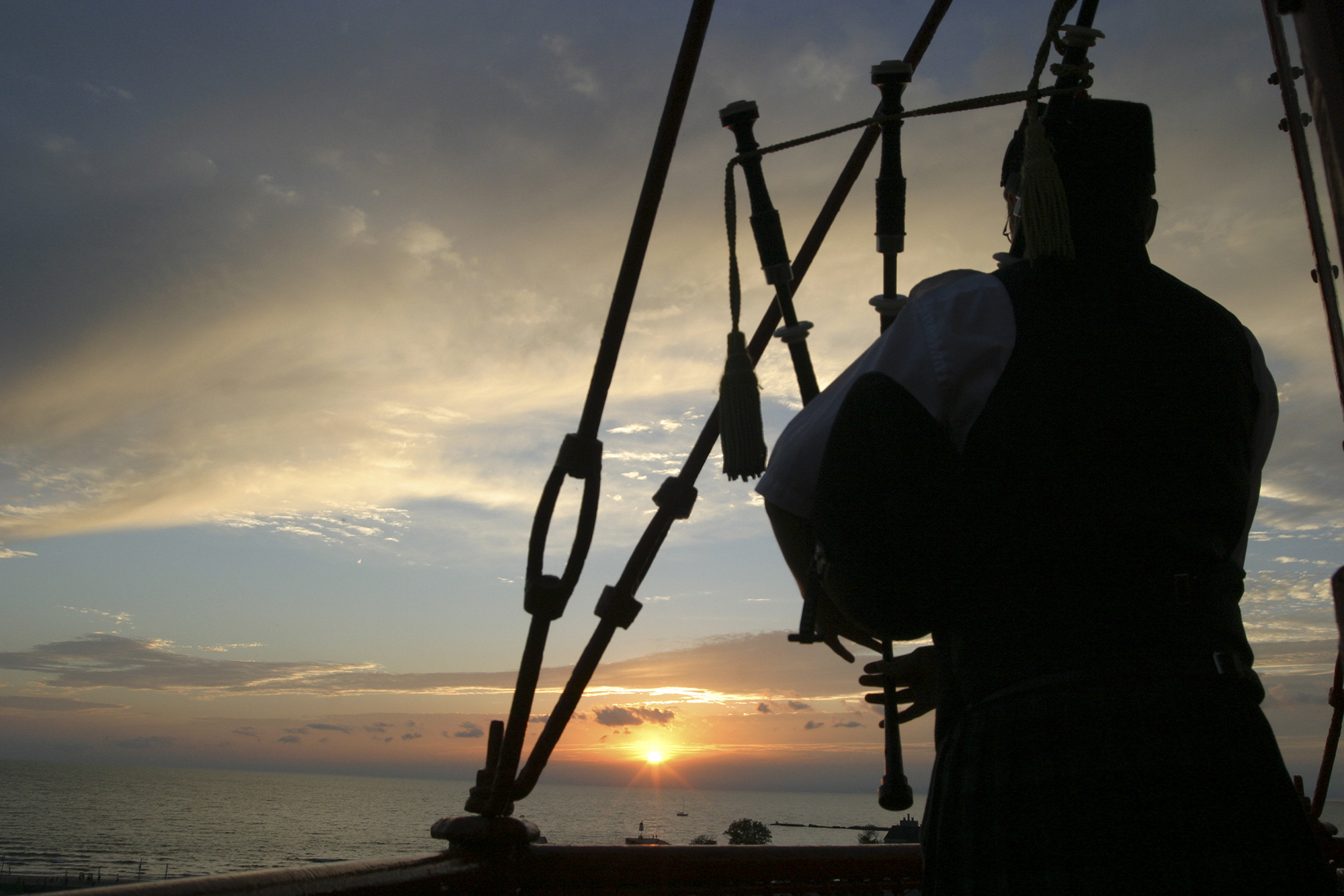 The Phantom Piper performs at sunset from the Kincardine Lighthouse.
