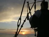 The Phantom Piper performs at sunset from the Kincardine Lighthouse.